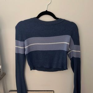 A cropped blue light sweater. Super trendy. Size small, barely worn.